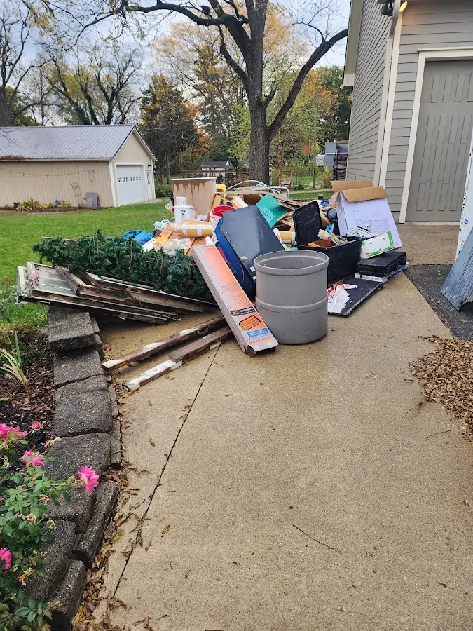 Dumpster being loaded with debris for 30 Yard Dumpster Rental in Manorhaven